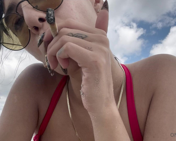 Janice Griffith aka Rejaniced OnlyFans - Having a smoke on the beach, do you like my red bikini